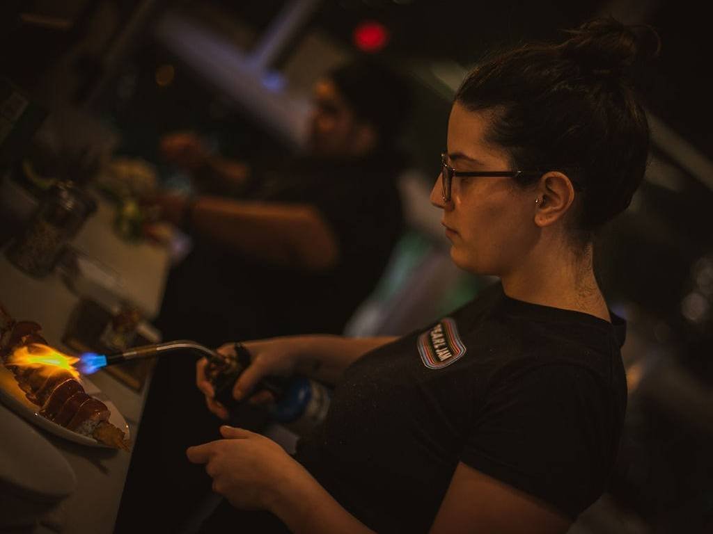 Clarimar holding a lit torch