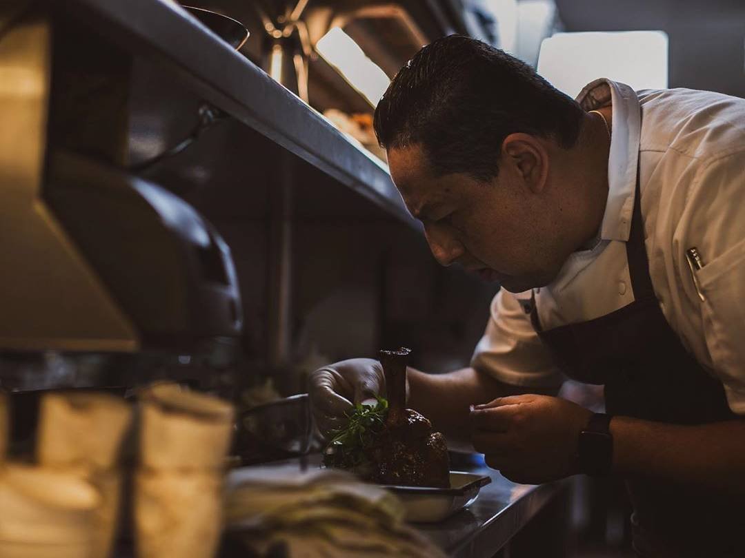 Richard working on a plate on the kitchen