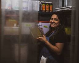 Legdy inside the restaurant walking fridge